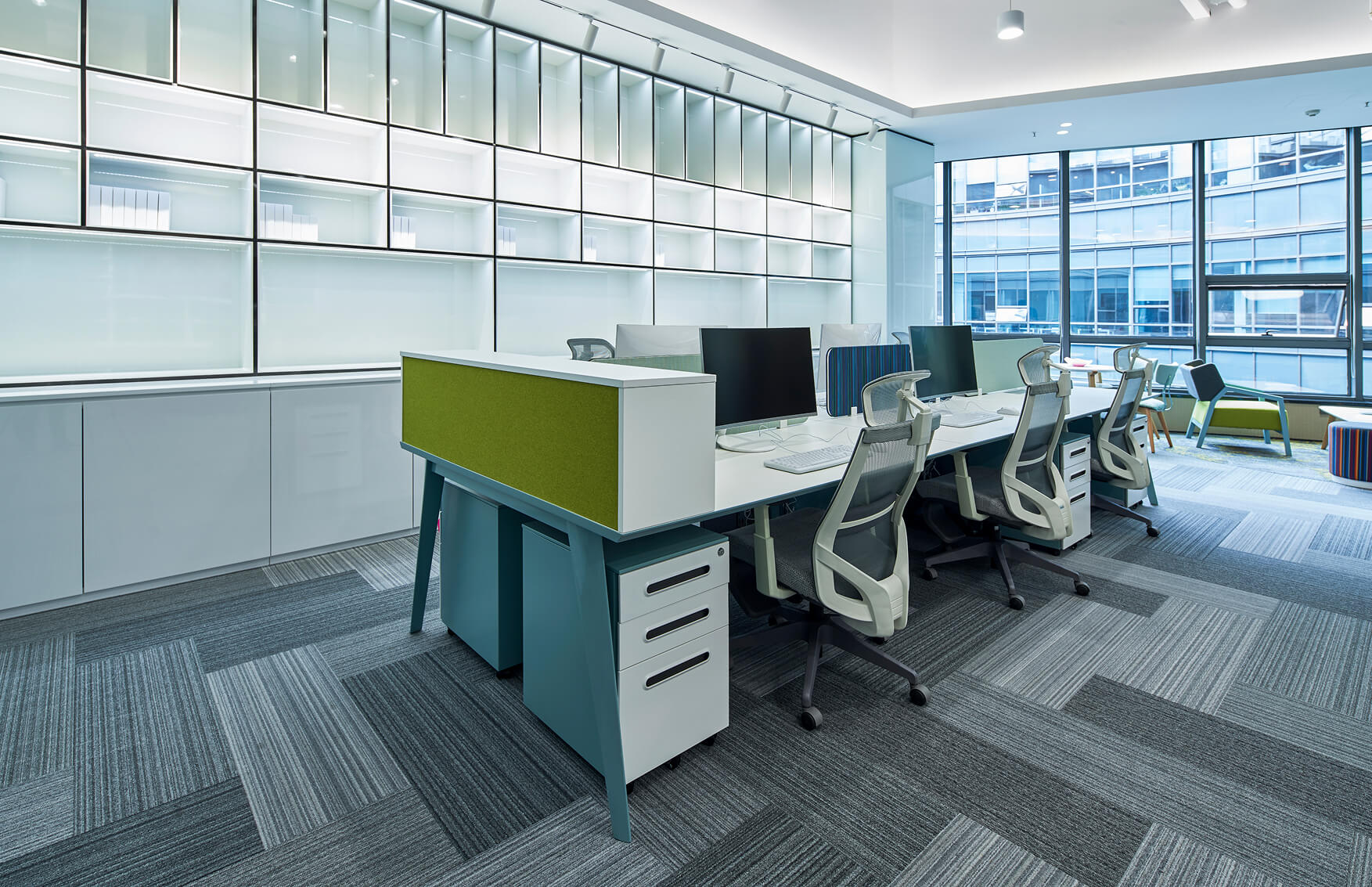 office space with large and window and clean carpet